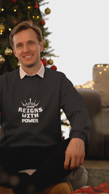 JESUS REIGNS WITH POWER UNISEX SWEATSHIRT